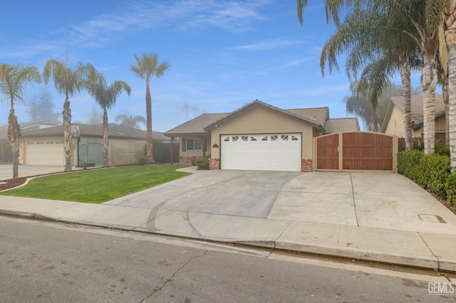 ranch-style home with a front yard and a garage