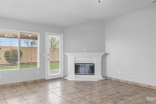 unfurnished living room featuring light tile patterned floors