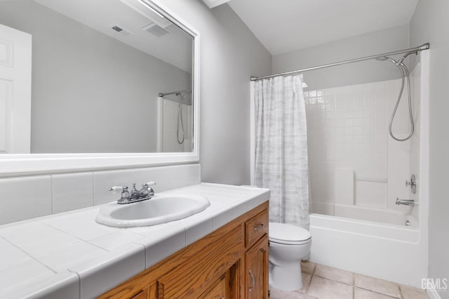 full bathroom with tile patterned floors, toilet, decorative backsplash, shower / bath combo with shower curtain, and vanity