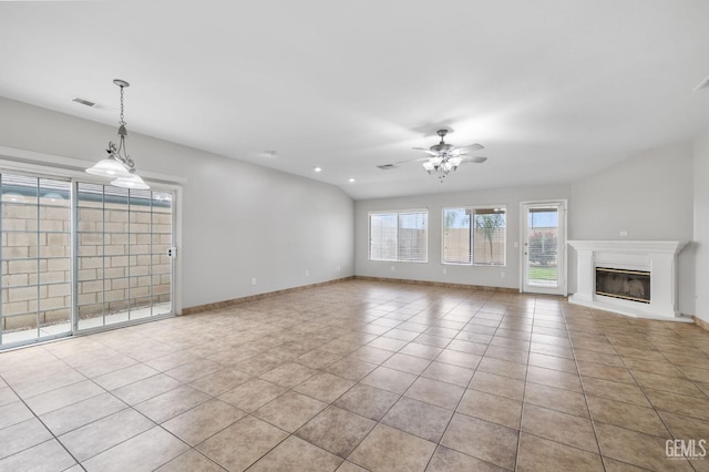 unfurnished living room with ceiling fan, light tile patterned floors, and lofted ceiling