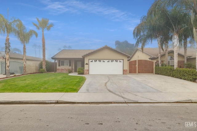 ranch-style home featuring a front yard and a garage