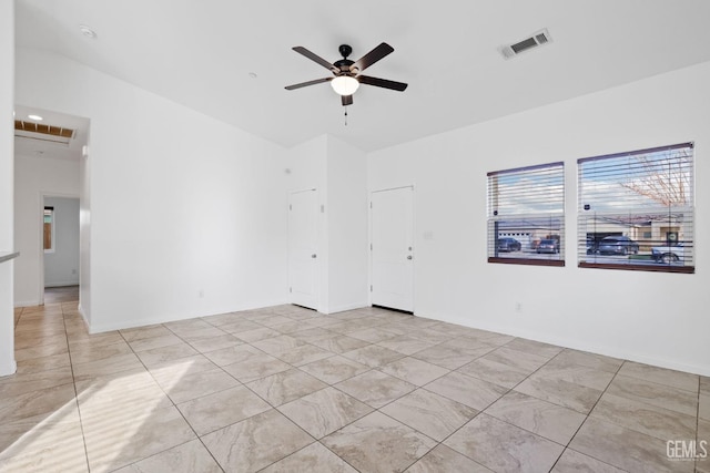 empty room with a ceiling fan and visible vents