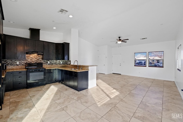 kitchen with a peninsula, a sink, visible vents, black gas stove, and open floor plan