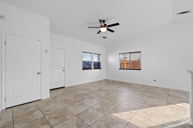 unfurnished room featuring lofted ceiling, visible vents, ceiling fan, and baseboards