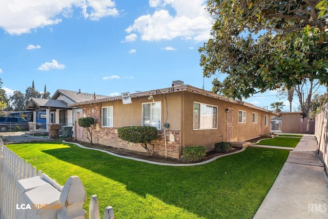 view of home's exterior featuring a lawn