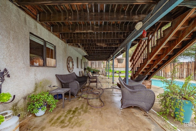 view of patio / terrace with a fenced in pool