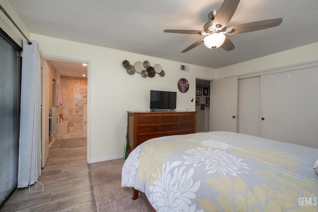 bedroom with ceiling fan, hardwood / wood-style floors, and a closet