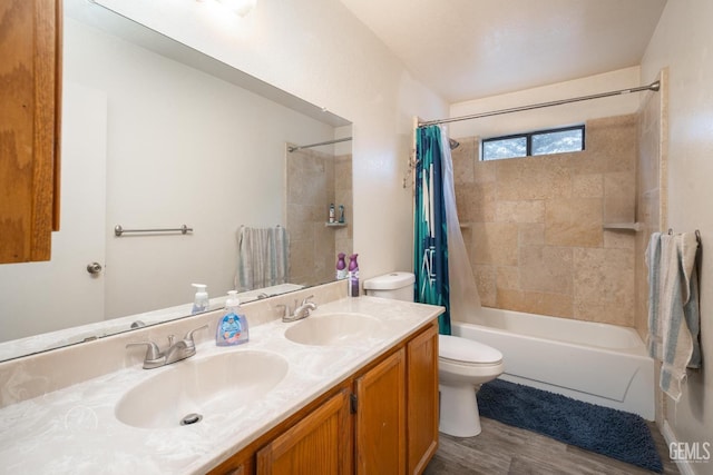 full bathroom with shower / tub combo, vanity, and toilet