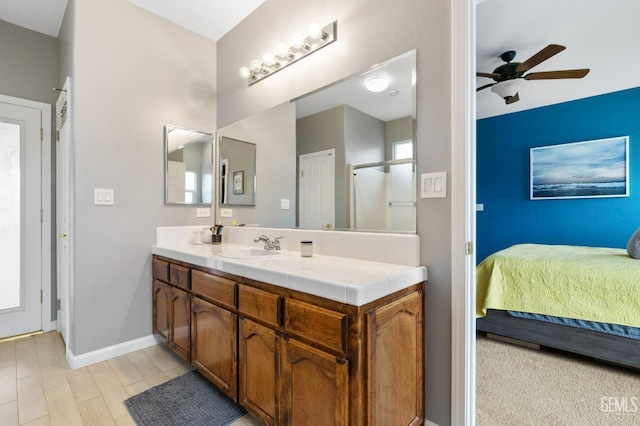 7303 Glenn Miller Ct, Bakersfield, CA 93312 - ensuite bathroom with vanity, baseboards, ensuite bath, ceiling fan, and a shower with shower door