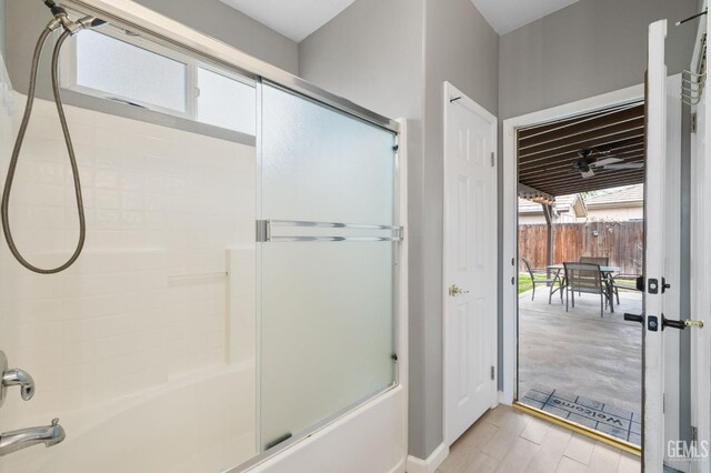 7303 Glenn Miller Ct, Bakersfield, CA 93312 - bathroom featuring baseboards, wood finished floors, and enclosed tub / shower combo