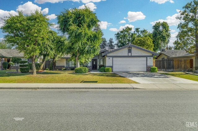 7205 Bandolero Way, Bakersfield, CA 93308 - view of front of house with stone siding, an attached garage, concrete driveway, and stucco siding