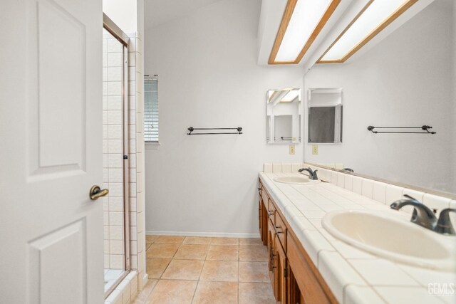 7205 Bandolero Way, Bakersfield, CA 93308 - bathroom with double vanity, a shower stall, baseboards, and tile patterned floors