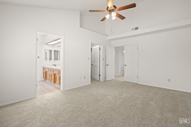 7205 Bandolero Way, Bakersfield, CA 93308 - unfurnished bedroom with light carpet, lofted ceiling, baseboards, a sink, and ensuite bath