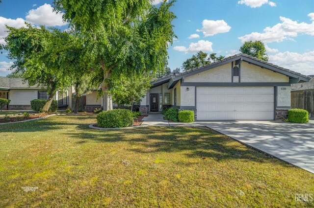 7205 Bandolero Way, Bakersfield, CA 93308 - single story home with stucco siding, a garage, a front lawn, and stone siding