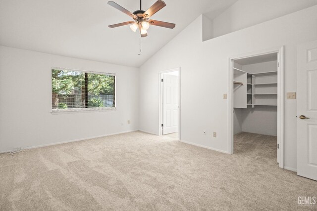 7205 Bandolero Way, Bakersfield, CA 93308 - unfurnished bedroom with light colored carpet, a walk in closet, high vaulted ceiling, baseboards, and ceiling fan