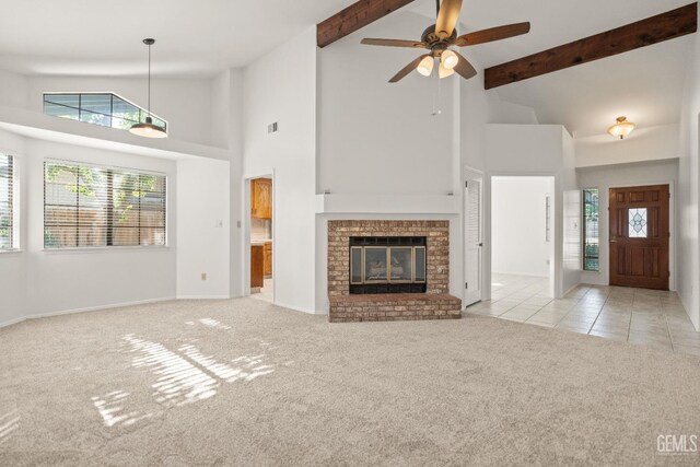 7205 Bandolero Way, Bakersfield, CA 93308 - unfurnished living room with light carpet, high vaulted ceiling, ceiling fan, plenty of natural light, and beam ceiling
