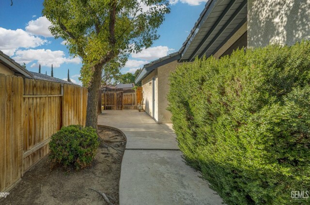 7205 Bandolero Way, Bakersfield, CA 93308 - view of home's exterior featuring stucco siding, a patio area, and a fenced backyard