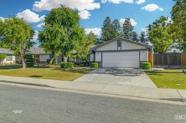 7205 Bandolero Way, Bakersfield, CA 93308 - ranch-style home featuring driveway, a garage, stone siding, and stucco siding