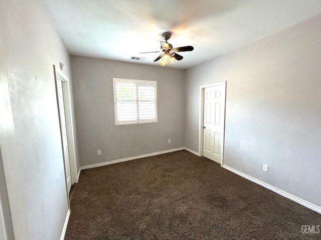 10315 Paradiso Way, Bakersfield, CA 93306 - unfurnished room featuring a ceiling fan, dark colored carpet, and baseboards