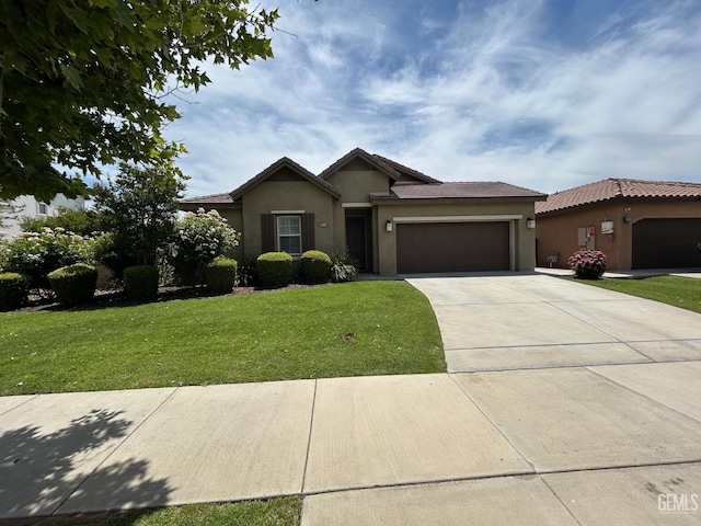 10315 Paradiso Way, Bakersfield, CA 93306 - ranch-style home featuring stucco siding, an attached garage, a front lawn, concrete driveway, and a tile roof