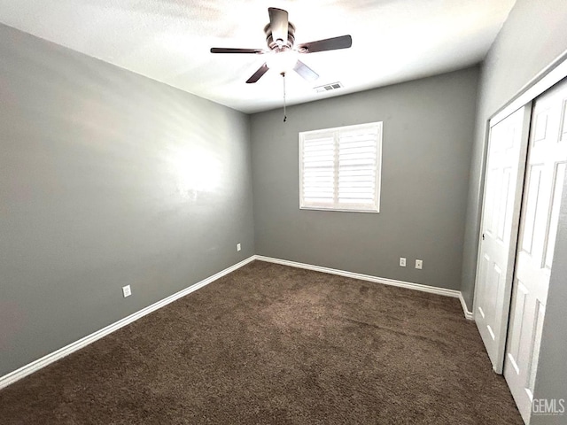10315 Paradiso Way, Bakersfield, CA 93306 - unfurnished room with a ceiling fan, dark colored carpet, and baseboards