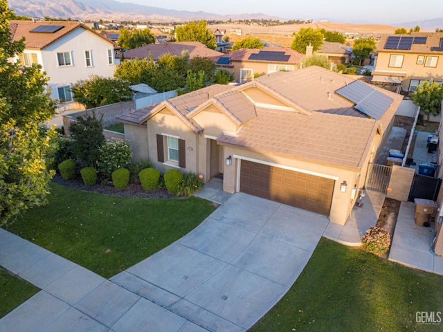 10315 Paradiso Way, Bakersfield, CA 93306 - view of front of property with stucco siding, a mountain view, an attached garage, and a residential view