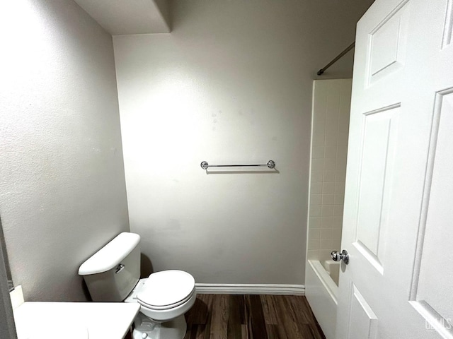10315 Paradiso Way, Bakersfield, CA 93306 - bathroom with wood finished floors, toilet, baseboards, vanity, and  shower combination