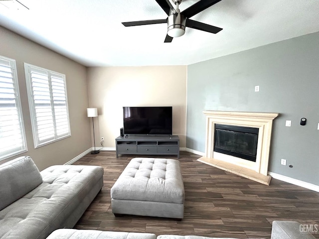 10315 Paradiso Way, Bakersfield, CA 93306 - living area featuring wood finished floors, a ceiling fan, baseboards, and a glass covered fireplace