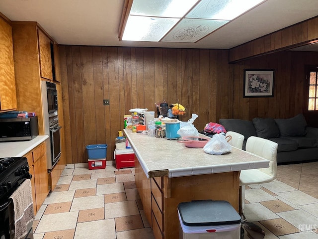 267 Cedar Ave, Earlimart, CA 93219 - dining space with wooden walls and light floors