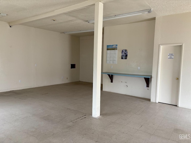 267 Cedar Ave, Earlimart, CA 93219 - below grade area with a textured ceiling and tile patterned floors