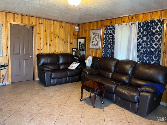 267 Cedar Ave, Earlimart, CA 93219 - living area with light tile patterned floors, wooden walls, a textured ceiling, and a healthy amount of sunlight
