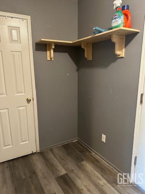 9306 Vista Colina Dr, Bakersfield, CA 93306 - washroom with dark wood-type flooring and baseboards