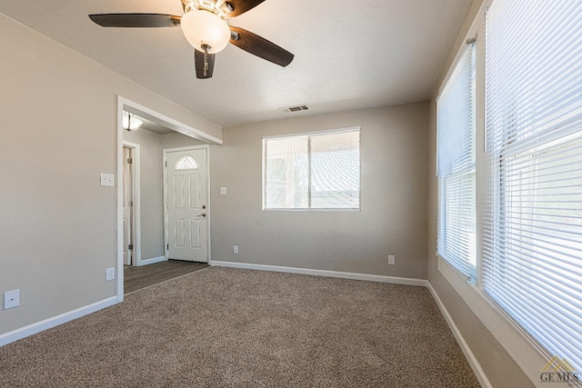 carpeted empty room with ceiling fan