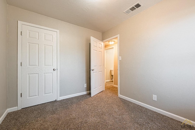 unfurnished bedroom with carpet flooring