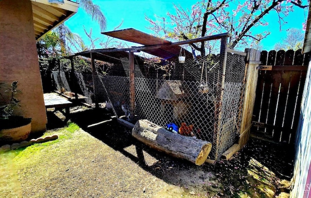 view of yard with an outbuilding and fence