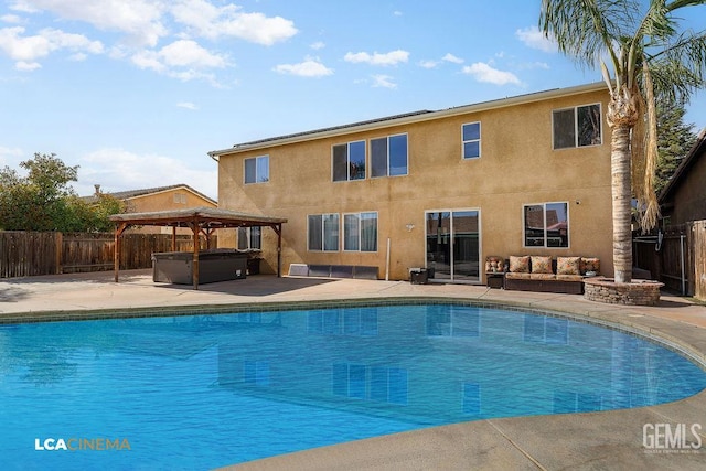 11703 Revolution Rd, Bakersfield, CA 93312 - view of swimming pool featuring a hot tub, a gazebo, a patio, a fenced backyard, and an outdoor hangout area