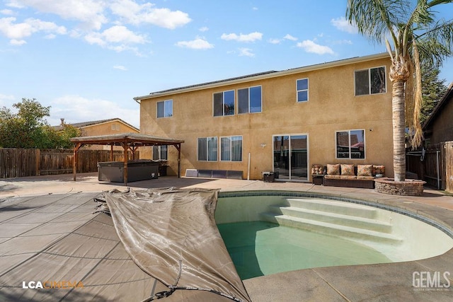 11703 Revolution Rd, Bakersfield, CA 93312 - view of pool featuring a hot tub, a fenced backyard, a gazebo, and a patio area