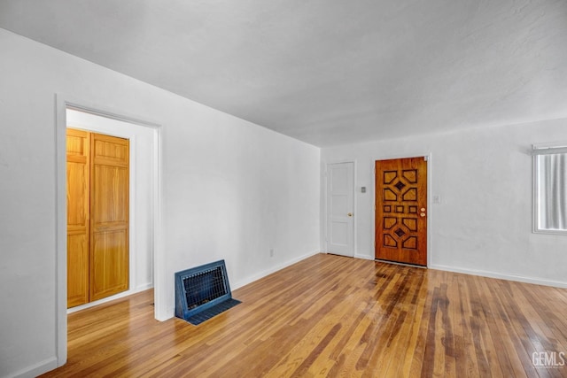 unfurnished living room featuring light hardwood / wood-style flooring