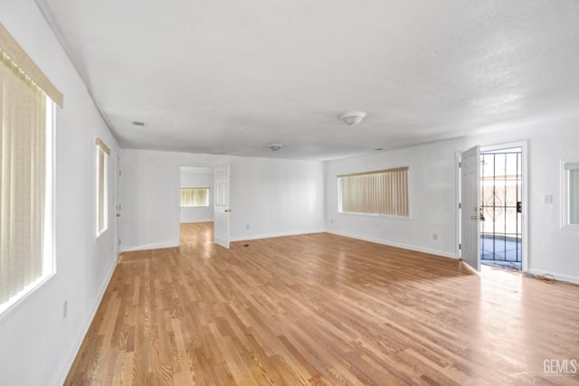 unfurnished living room with light hardwood / wood-style floors