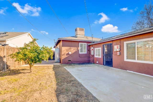 rear view of house with a patio