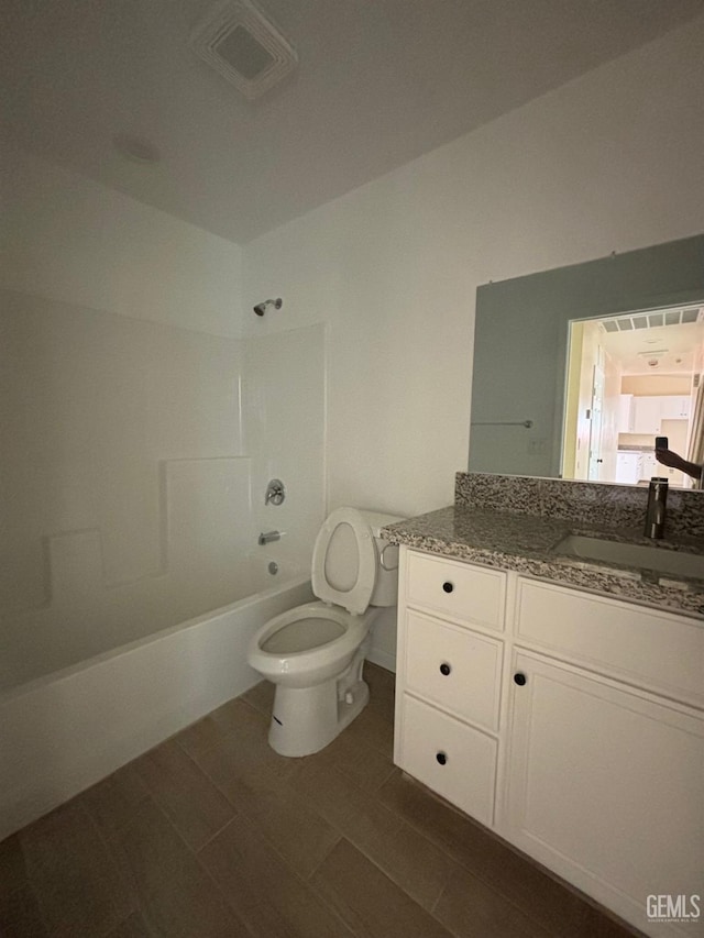 bathroom featuring toilet, visible vents, shower / bathing tub combination, and vanity