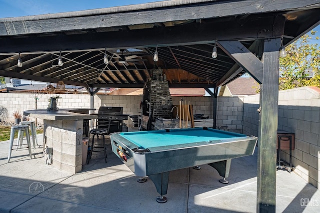 view of patio / terrace with area for grilling, a gazebo, and exterior bar