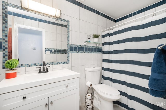 bathroom featuring tile walls, backsplash, vanity, toilet, and a shower with curtain