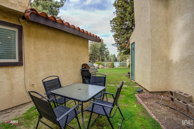 view of patio featuring a grill and outdoor dining space