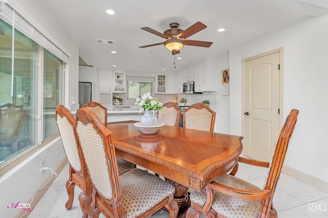 dining room with a ceiling fan, recessed lighting, visible vents, and light tile patterned floors