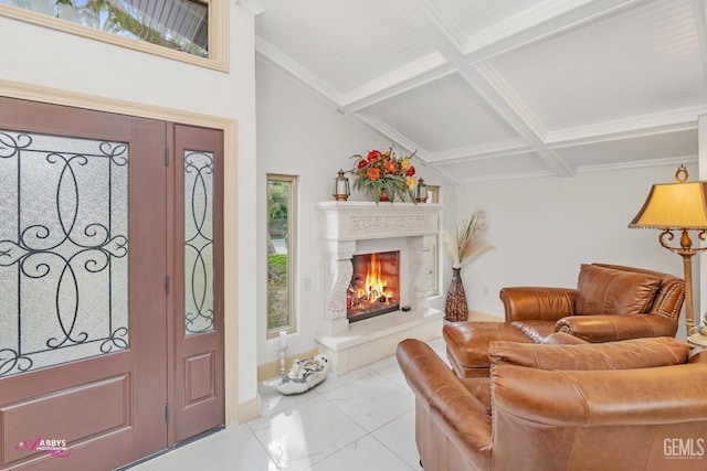 foyer entrance with beam ceiling, coffered ceiling, crown molding, and a lit fireplace