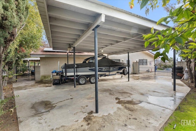 view of vehicle parking with a carport