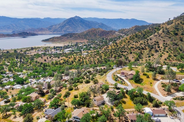 drone / aerial view with a water and mountain view