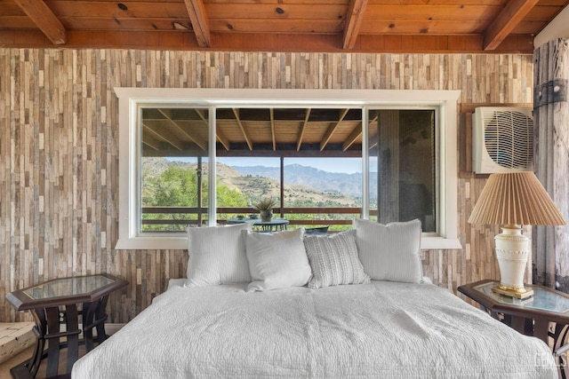 bedroom with beamed ceiling, a mountain view, wood walls, and wood ceiling