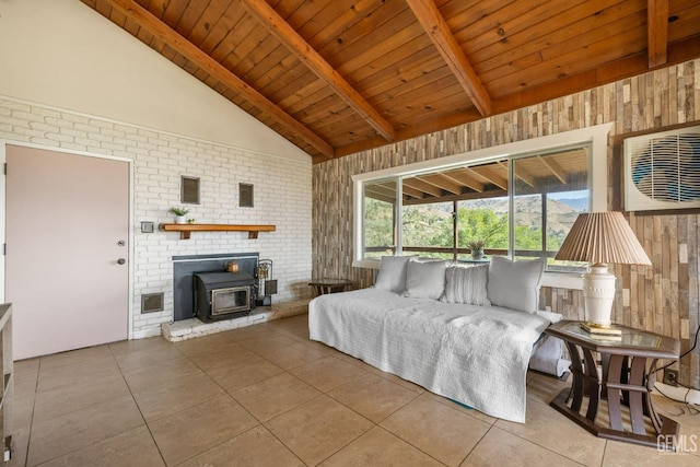bedroom featuring tile patterned floors, vaulted ceiling with beams, wooden walls, a wood stove, and wooden ceiling